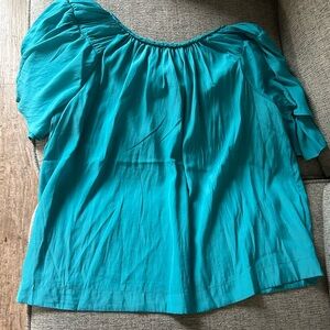 Brand new. Never worn. Short sleeve blouse. Size M.